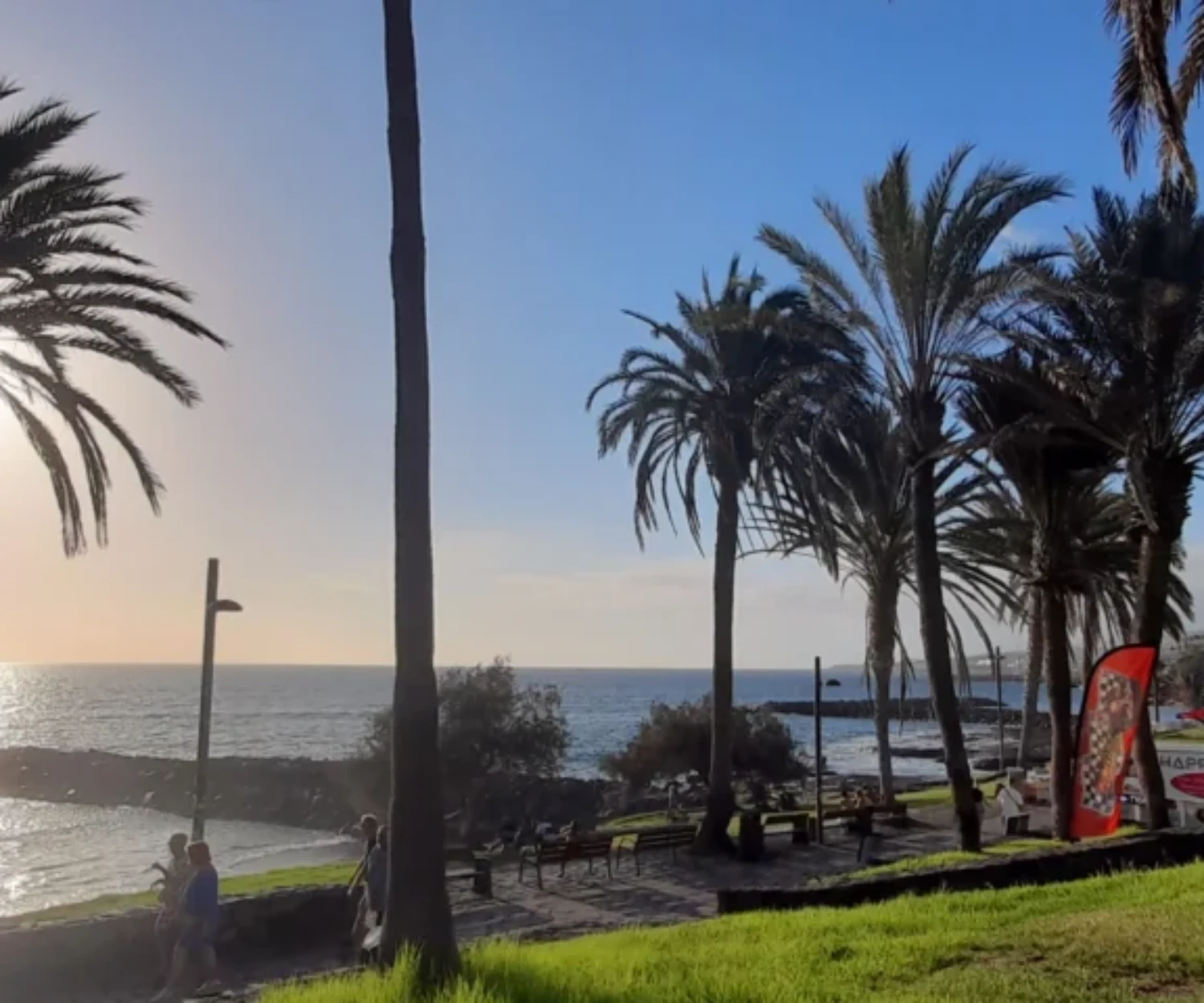 Adult daughter enjoying a sunny Tenerife holiday with her elderly mother